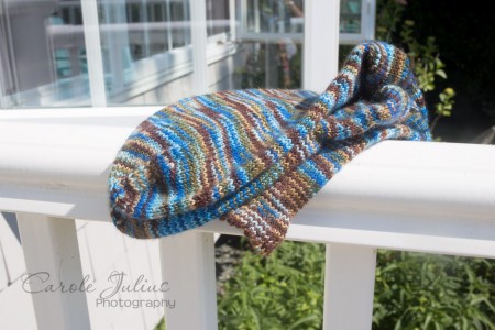sea coast socks on railing folded for carole knits